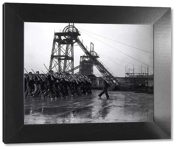 Member of the Home Guard marching at a coal mine during WW2