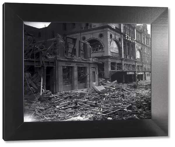 Bomb damage on the South Coast during WW2 rubble and debris cover the street