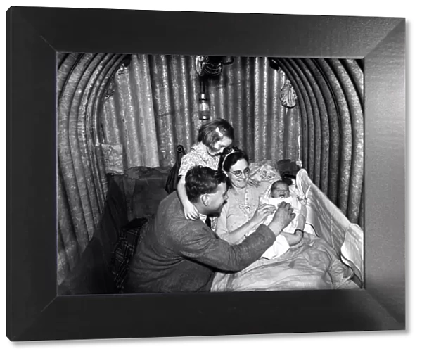 Family inside Air Raid Shelter during WW2