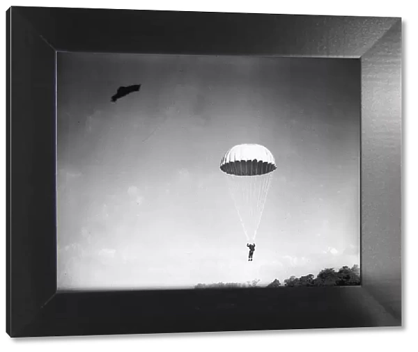 A parachutist in descent during WW2. Circa 1942