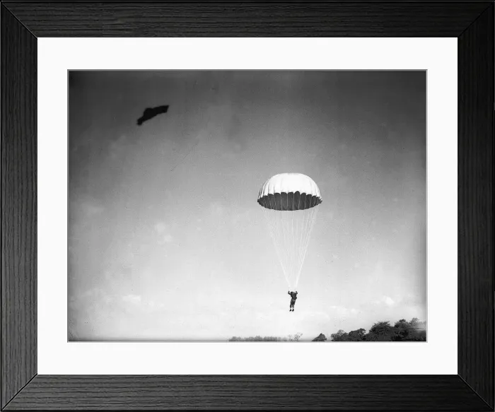 Framed Print : A parachutist in descent during WW2. Circa 1942 Framed Print : A parachutist in descent during WW2. Circa 1942