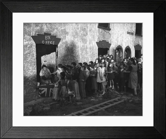 Framed Print : Children queue for show during London blitz The misery of the Blitz is partly alleviated Framed Print : Children queue for show during London blitz The misery of the Blitz is partly alleviated