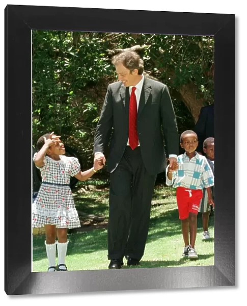 Tony Blair South Africa Visit January 1999 with the Aids child he sponsors at