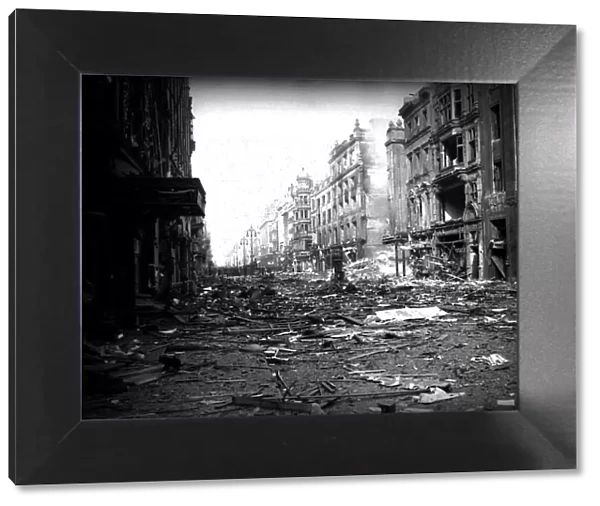Bomb damage London during WW2 rubble and debris lay in the street