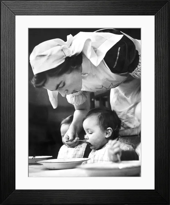 Framed Print : A St Johns nurse at work at the Villa Day Nursery opened for the express purpose of Framed Print : A St Johns nurse at work at the Villa Day Nursery opened for the express purpose of