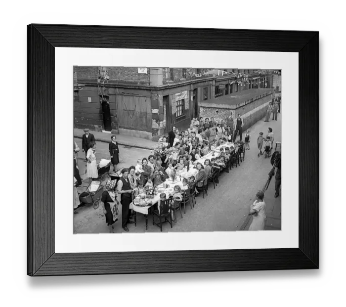 Framed Print : Families have fun at a street party to celebrate VE day to mark the end of WW2 in Europe Framed Print : Families have fun at a street party to celebrate VE day to mark the end of WW2 in Europe