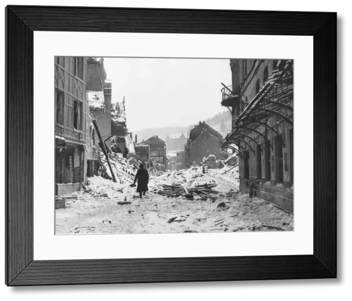 Framed Print : A soldiers walks through snow covered ruins of Laroche after it had been shelled by Framed Print : A soldiers walks through snow covered ruins of Laroche after it had been shelled by