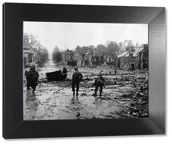 WW2 Royal Engineers clearing mines from the main street in Tilly-Sur-Seulles