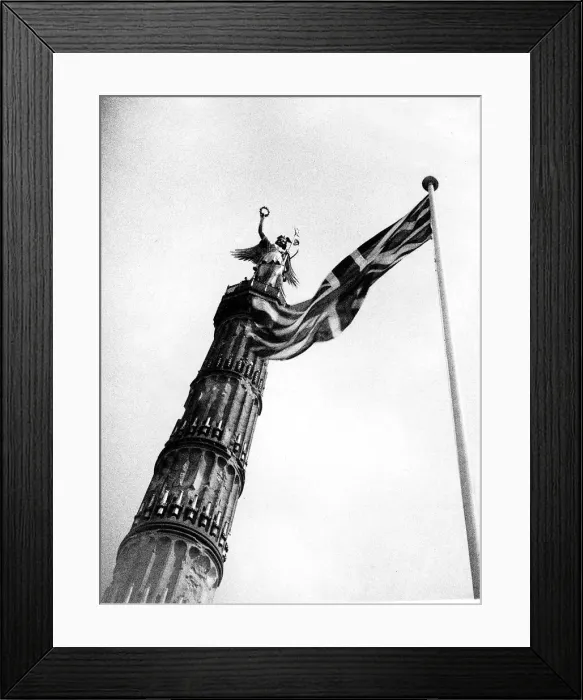 Framed Print : Union Jack flag flying beside the German victory column from the war of 1870 Framed Print : Union Jack flag flying beside the German victory column from the war of 1870