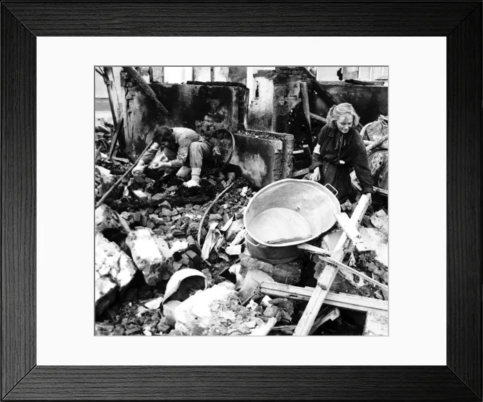 Framed Print : Girl rescue worker searching among the ruins of Eindhoven after another air raid by Framed Print : Girl rescue worker searching among the ruins of Eindhoven after another air raid by