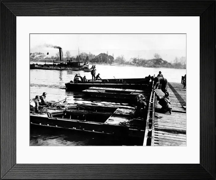 Framed Print : Section of army treadway bridge is pushed into place by landing craft personnel Framed Print : Section of army treadway bridge is pushed into place by landing craft personnel