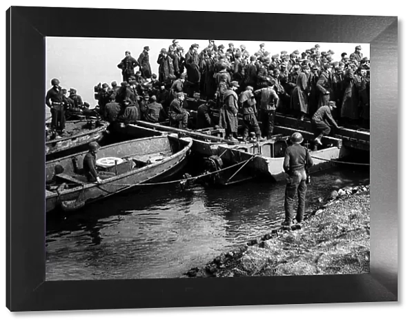 Rhine crossing of Us third army barge discharging german prisoners after crossing