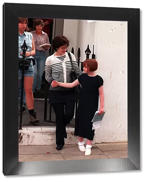 Cherie Blair outside her home with child. May 1997