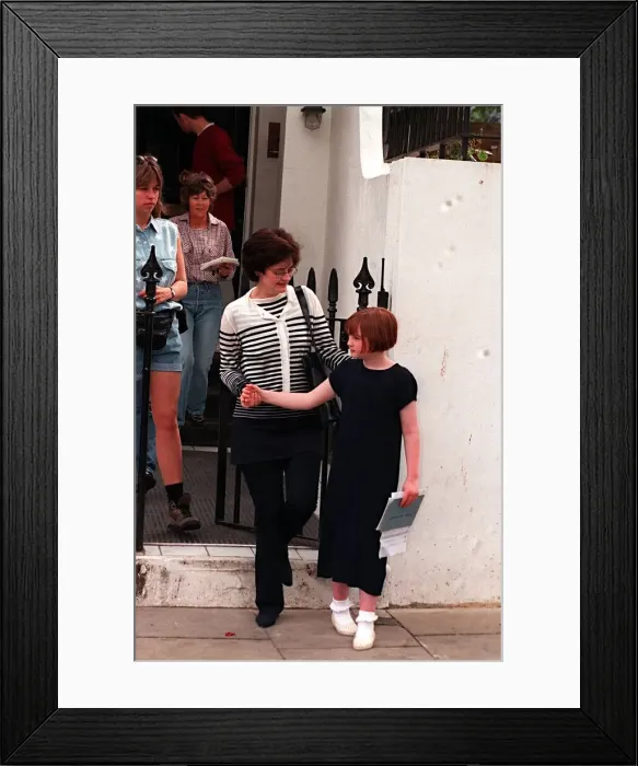 Framed Print : Cherie Blair outside her home with child. May 1997 Framed Print : Cherie Blair outside her home with child. May 1997