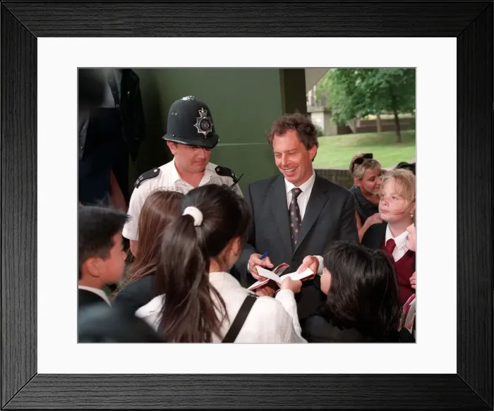 Framed Print : Tony Blair visits a council estate in London June 1997, signing autographs whilst meeting Framed Print : Tony Blair visits a council estate in London June 1997, signing autographs whilst meeting