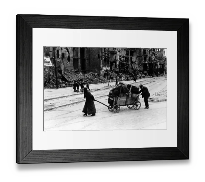 Framed Print : Elderly woman assisted by her husband walk through the Liepzig Strasse Berlin amid Framed Print : Elderly woman assisted by her husband walk through the Liepzig Strasse Berlin amid