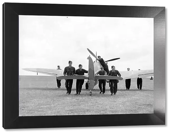 RAF ground crew push back a damage aeroplane to the hangar during the Battle of Britain