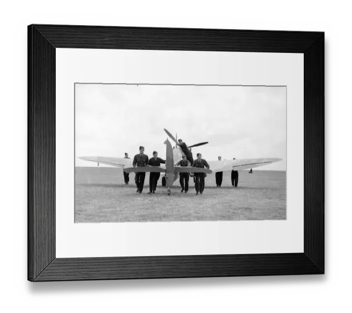 Framed Print : RAF ground crew push back a damage aeroplane to the hangar during the Battle of Britain Framed Print : RAF ground crew push back a damage aeroplane to the hangar during the Battle of Britain