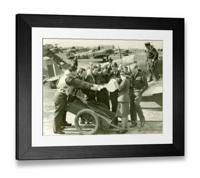 Framed Print : Royal Air Force fighter pilots hold out their mugs whilst a Waaf girl pours them some tea