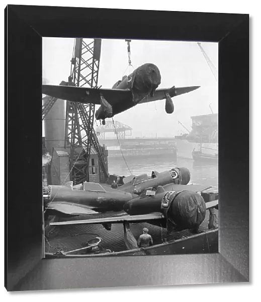 P47 Thunderbolt Aircraft are unloaded from a ship in a northern UK port