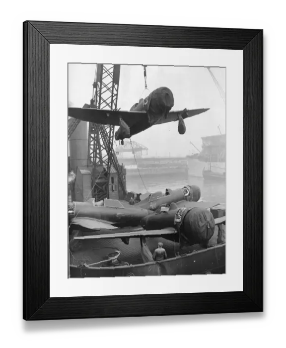Framed Print : P47 Thunderbolt Aircraft are unloaded from a ship in a northern UK port Framed Print : P47 Thunderbolt Aircraft are unloaded from a ship in a northern UK port
