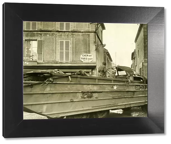 World War II Invasion of France D-Day + 8 A British army DUKW passes through