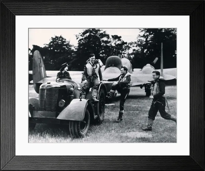 Framed Print : A Waaf driving a tractor tows a RAF Hudson bomber and its crew back to their dispersal Framed Print : A Waaf driving a tractor tows a RAF Hudson bomber and its crew back to their dispersal