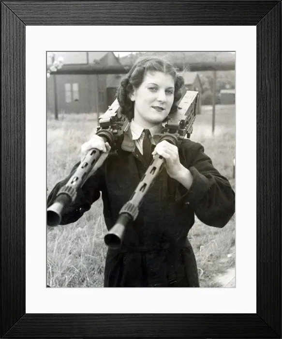 Framed Print : WaF with a couple of Browning machine-guns perched on her shoulders Framed Print : WaF with a couple of Browning machine-guns perched on her shoulders