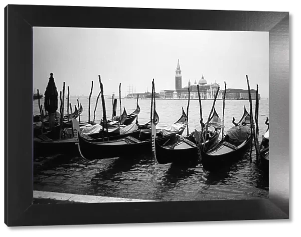 Italy Venice Gondolas and gondoliers on a rainy day June 1965