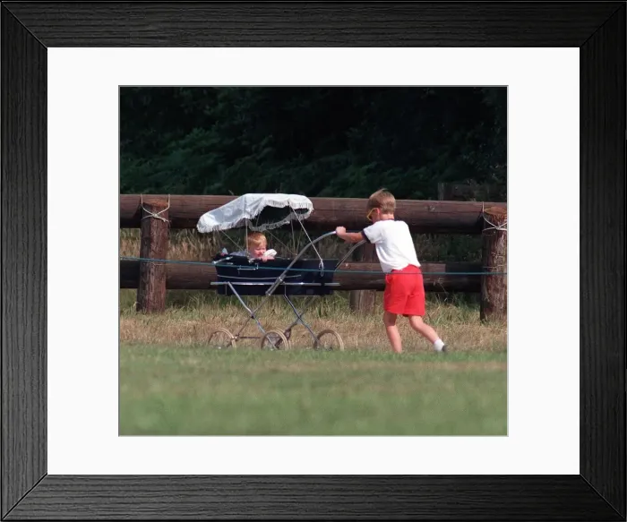 Framed Print : Prince William Collection 1989 Prince William pushing Princess Beatrice in pram Framed Print : Prince William Collection 1989 Prince William pushing Princess Beatrice in pram