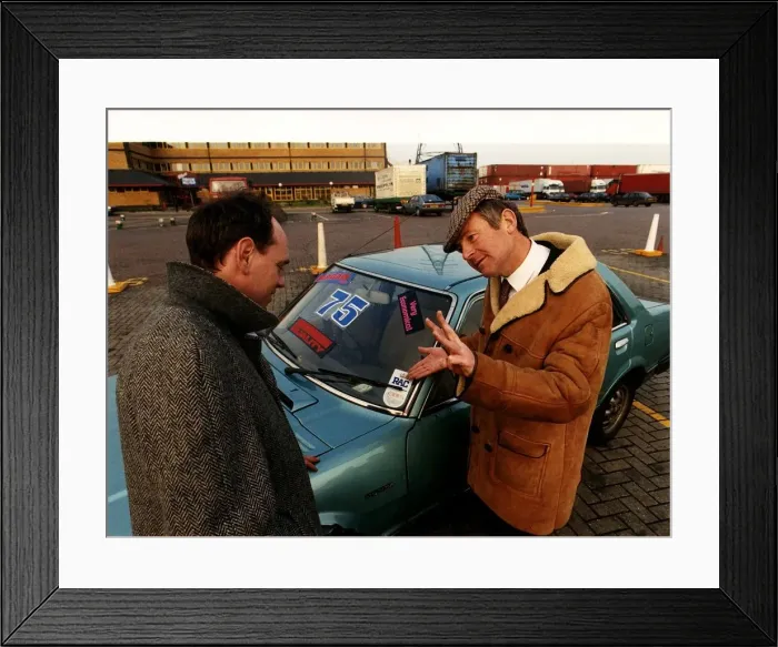 Framed Print : Motors Second Hand a salesman selling a used car to a customer Framed Print : Motors Second Hand a salesman selling a used car to a customer