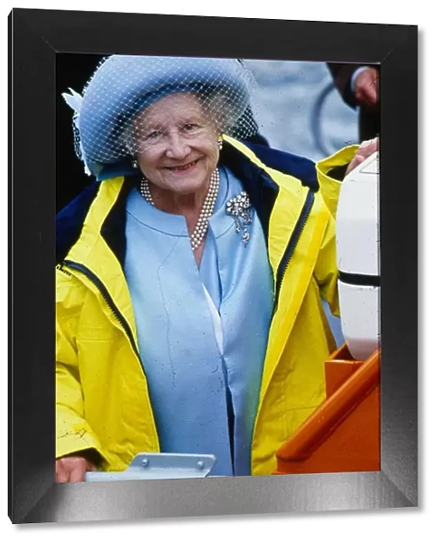 Queen Mother August 1989 wearing a yellow mac after naming Thurso lifeboat