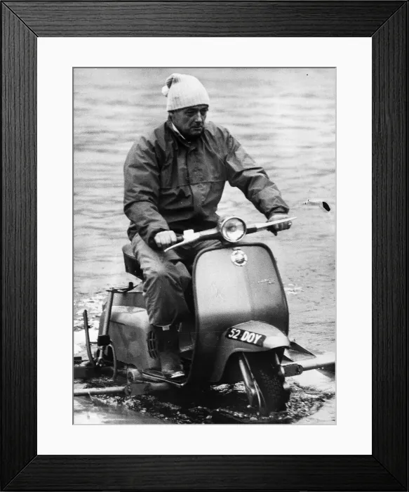 Framed Print : Donald Campbell rides a water scooter on Coniston Water in 1966 Framed Print : Donald Campbell rides a water scooter on Coniston Water in 1966