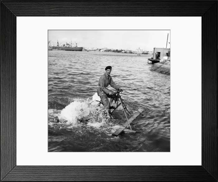 Framed Print : Suez Crisis 1956 Liet John Young crossing Port Said harbour on a pedal bike raft Framed Print : Suez Crisis 1956 Liet John Young crossing Port Said harbour on a pedal bike raft