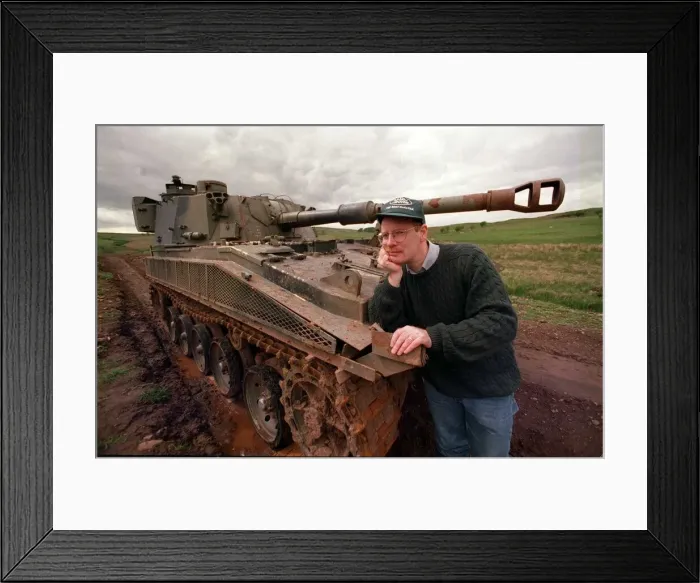 Framed Print : 4X4 off road instruction for road record instructor beside battle tank circa 1990s