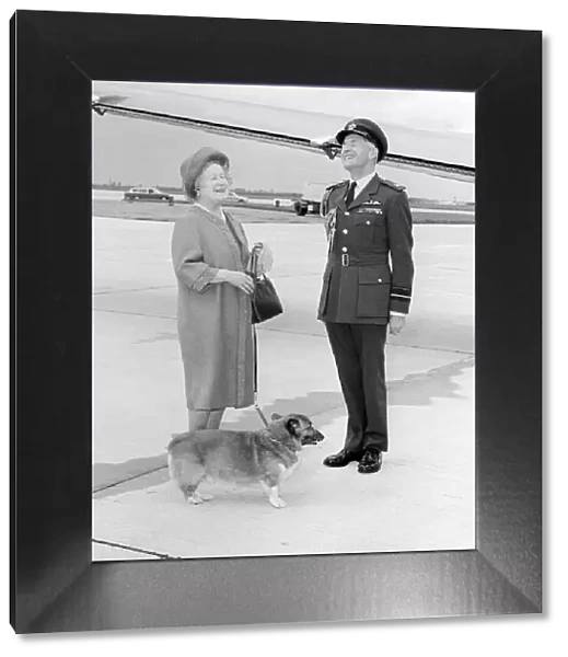 Queen Mother with RAF officer and corgi at Heathrow Airport in May 1983