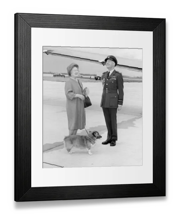 Framed Print : Queen Mother with RAF officer and corgi at Heathrow Airport in May 1983