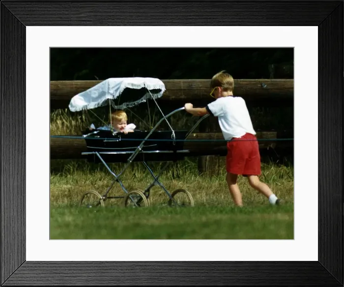 Framed Print : Prince William Collection 1989 Princess Beatrice in pram being pushed by her cousin Framed Print : Prince William Collection 1989 Princess Beatrice in pram being pushed by her cousin