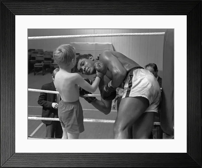 Framed Print : Cassius Clay with 6 year old Patrick Power in the ring during his training for