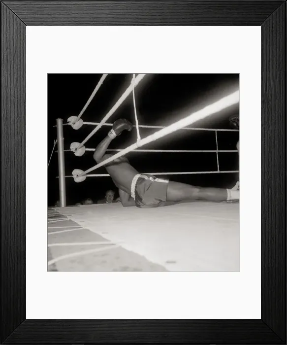 Framed Print : Action during the non-title heavyweight fight between American Cassius Clay