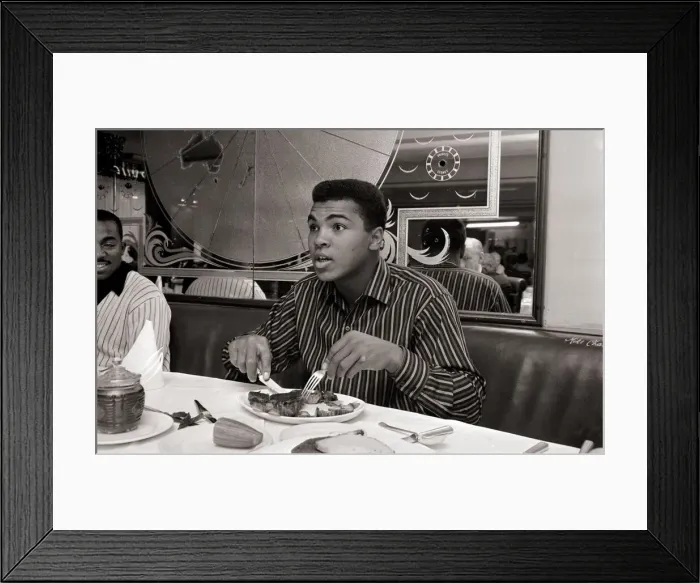 Framed Print : Cassius Clay eating Steaks at Isows restuarant in Brewer Street, Soho, London Framed Print : Cassius Clay eating Steaks at Isows restuarant in Brewer Street, Soho, London