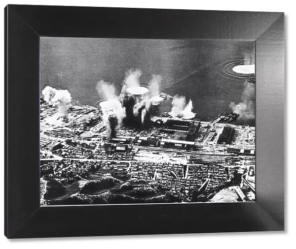 Allied bombs explode on dockside at Fuge Honshu Japan during a WW2 air raid - 1945