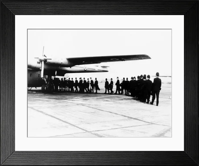 Framed Print : Riot squad police entering transport plane on their way to Hastings because of Teenage Framed Print : Riot squad police entering transport plane on their way to Hastings because of Teenage
