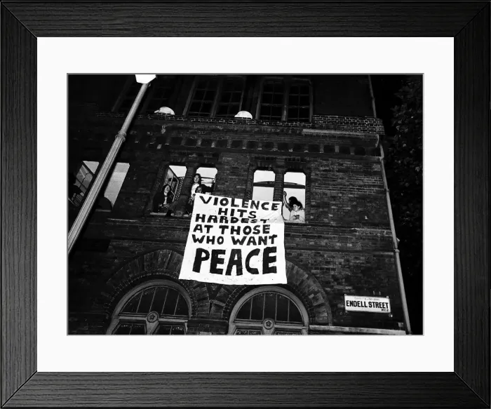 Framed Print : Hippies with banner hanging from window before police arrived to evict them from their Framed Print : Hippies with banner hanging from window before police arrived to evict them from their