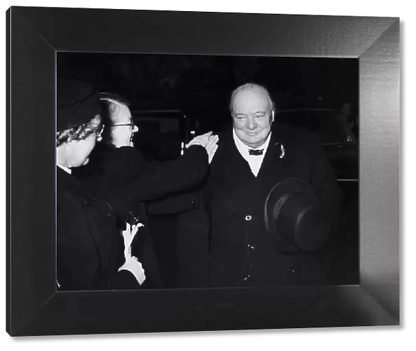 Winston Churchill MP and former WW2 British Prime Minister being congratulated by one of