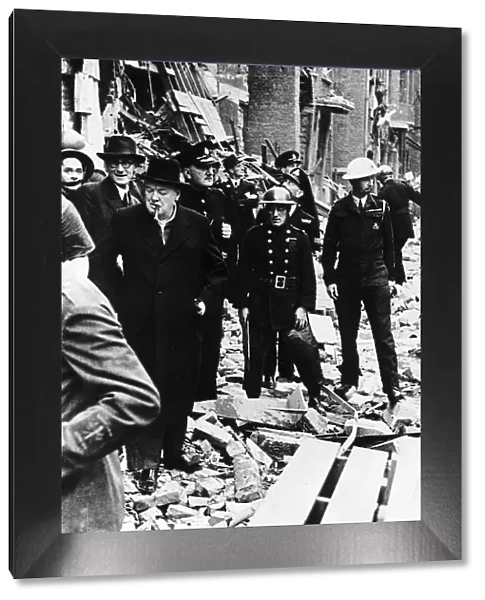 British Prime Minister Winston Churchill inspects the damage done by a flying bomb