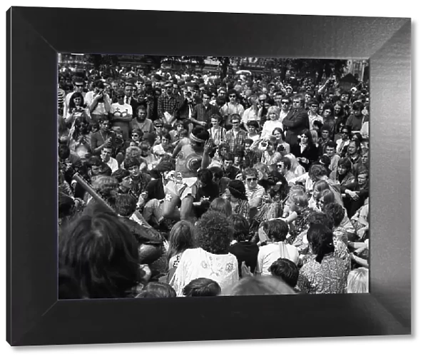 David medalla leads a group of hippies chanting at 1967 Hyde park in London watched