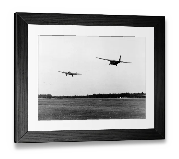 Framed Print : Halifax bomber towing a glider takes off from English airfield as part of the Allied Framed Print : Halifax bomber towing a glider takes off from English airfield as part of the Allied