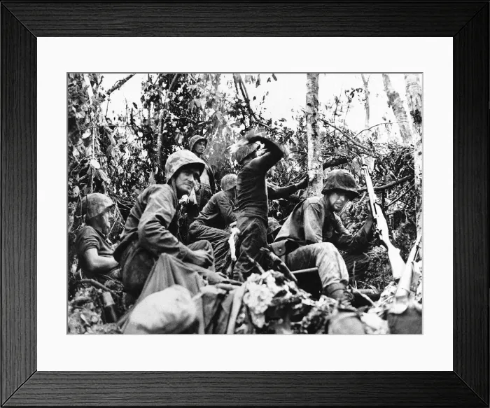 Framed Print : US marine about to throw a handgrenade at the enemy as his unit fights its way Framed Print : US marine about to throw a handgrenade at the enemy as his unit fights its way