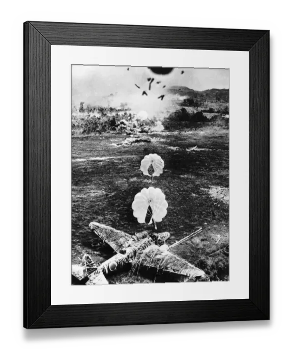 Framed Print : The US Air Force drop parafrag bombs on a Japanese airfield during WW2